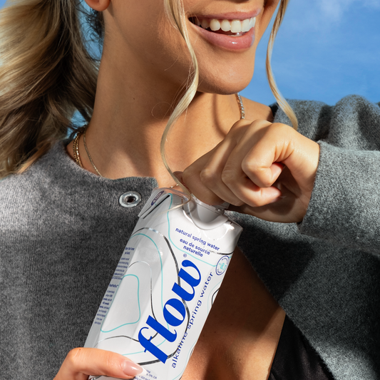 Woman smiling holding Flow